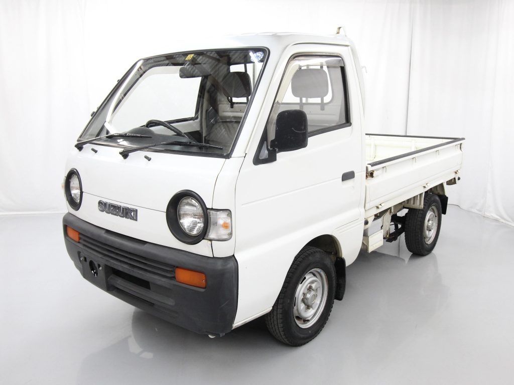 Kei Trucks or Mini Vehicles? Kei trucks have less seating options like this white Kei Truck.